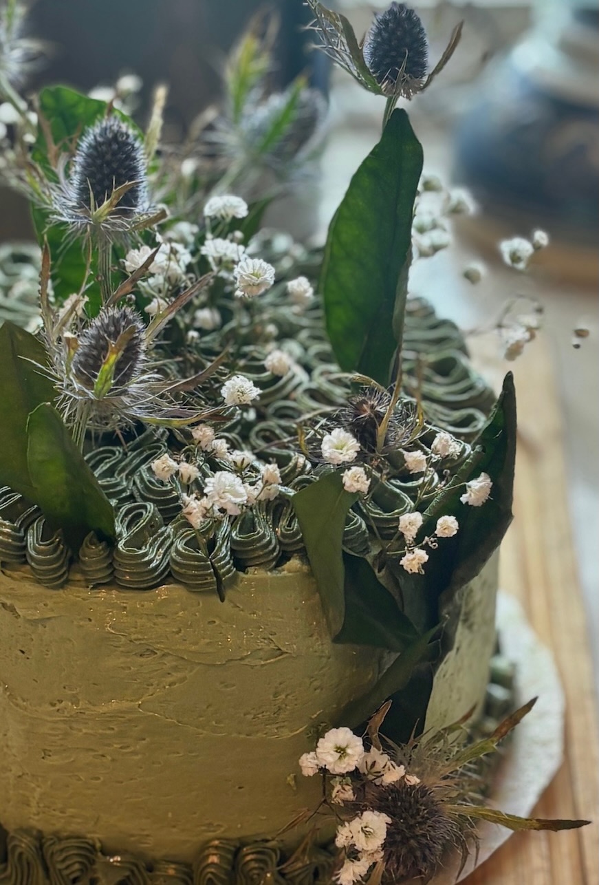 Sage green thistle cake close-up detail